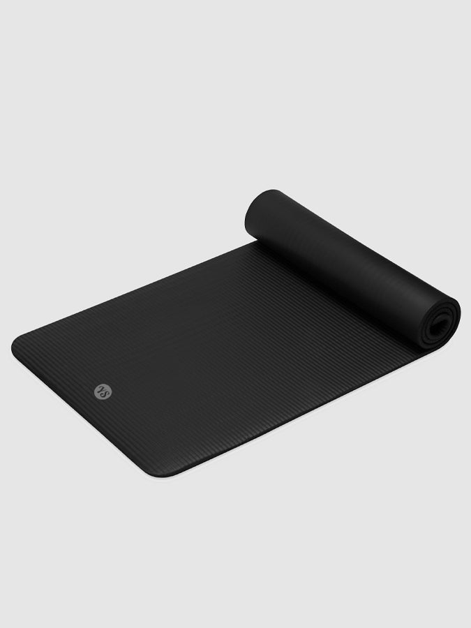 Black fitness mat rolled for compact storage